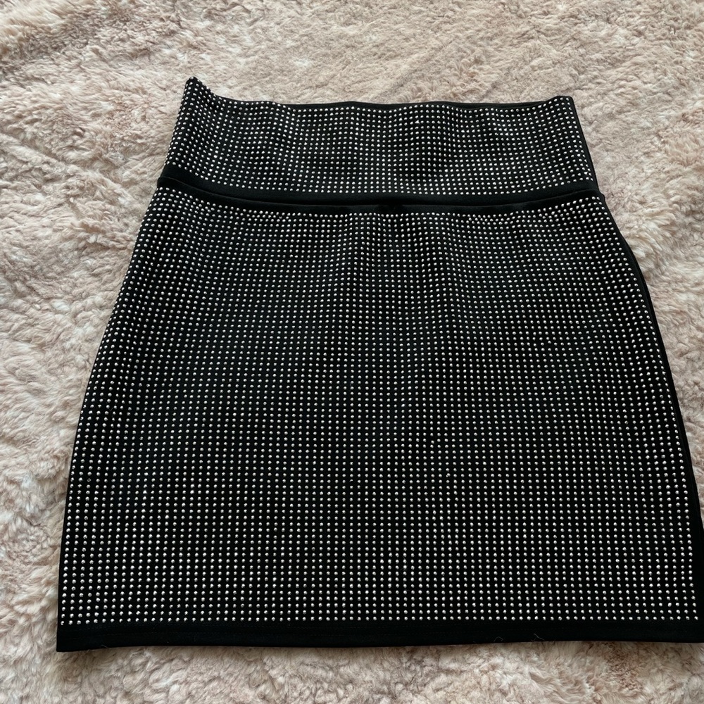 Fashion nova mini skirt. Black with mini studs. Fancy. Good quality. Size L.